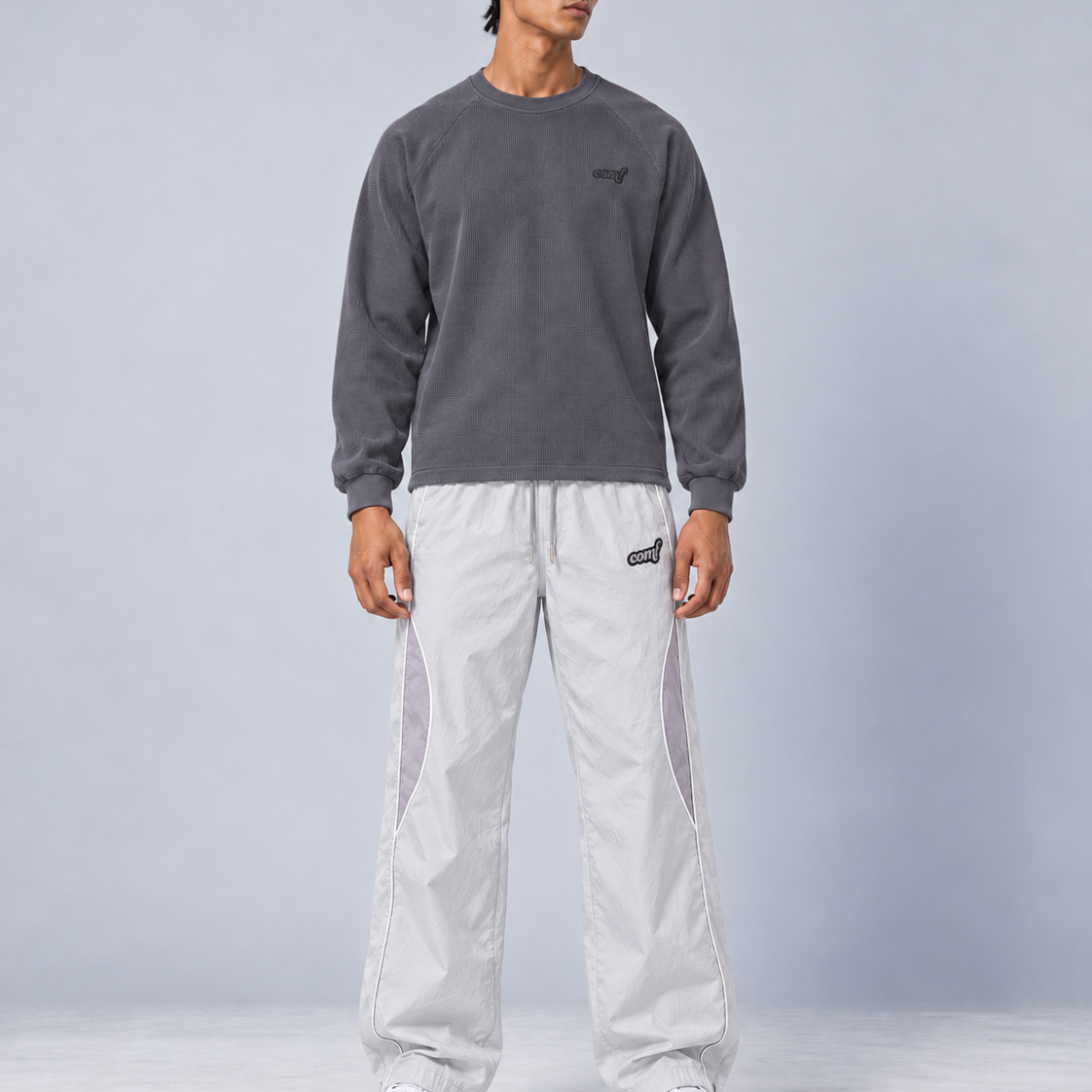 AI styling visualization: COMF Washed Charcoal waffle long sleeve with Platinum track pants on a model