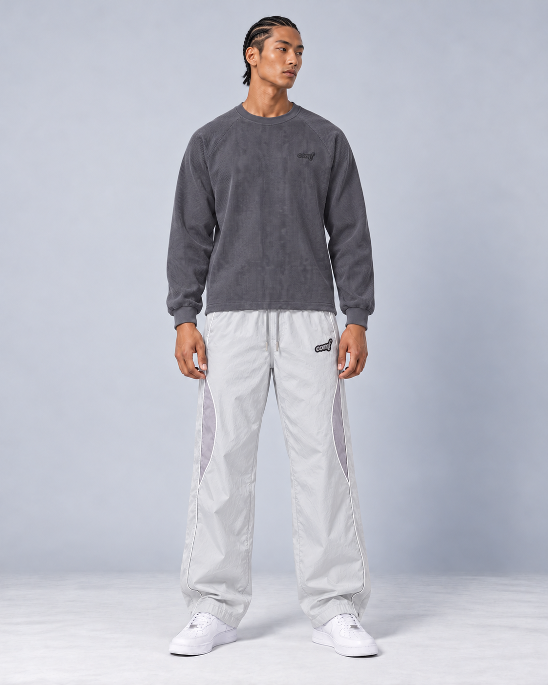 AI styling visualization: COMF Washed Charcoal waffle long sleeve with Platinum track pants on a model